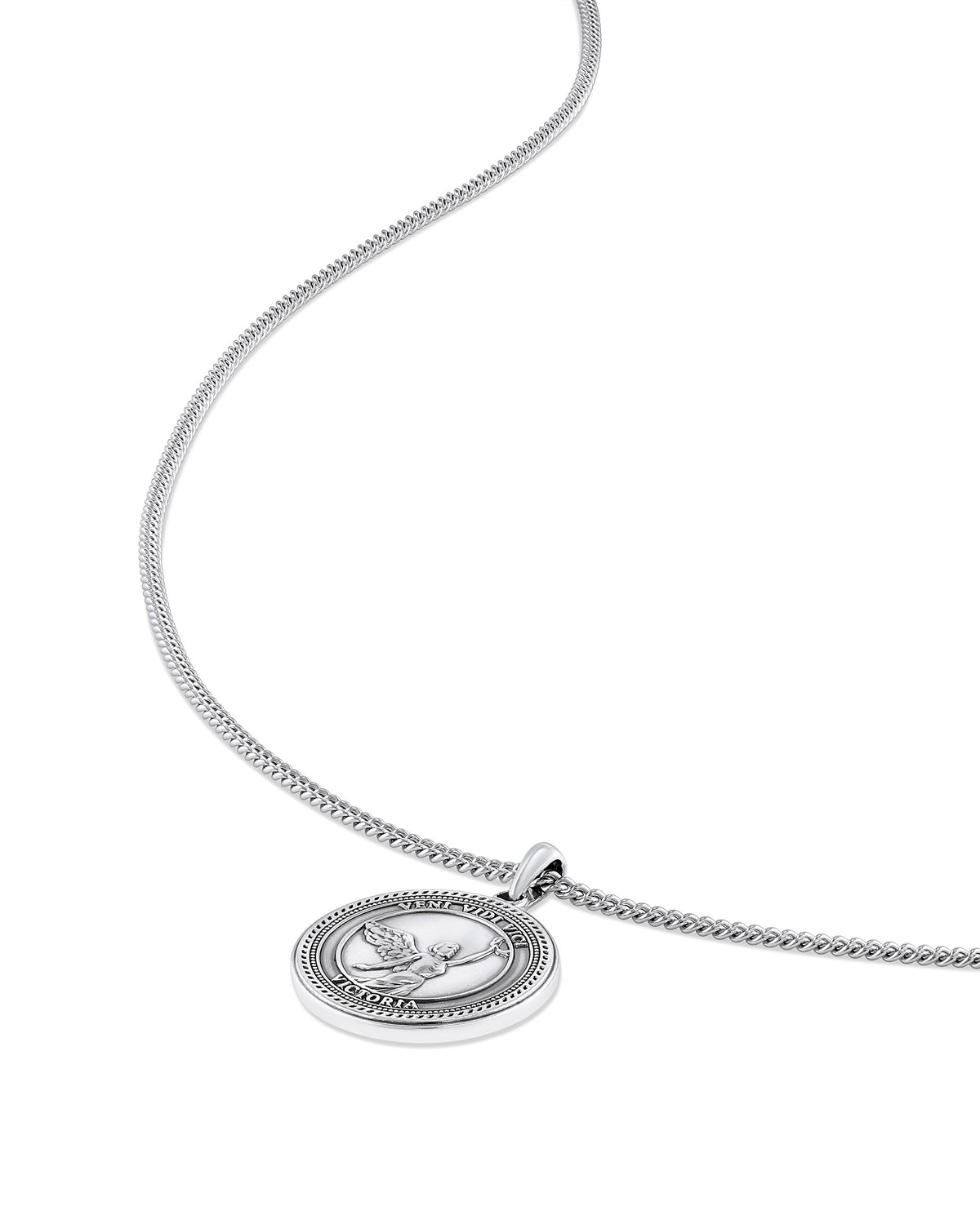 A sterling silver necklace with a round pendant featuring an embossed design, displayed against a white background.
