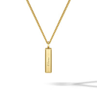 Gold necklace with a bar pendant on a white background