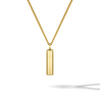 Gold necklace with a rectangular pendant on a white background
