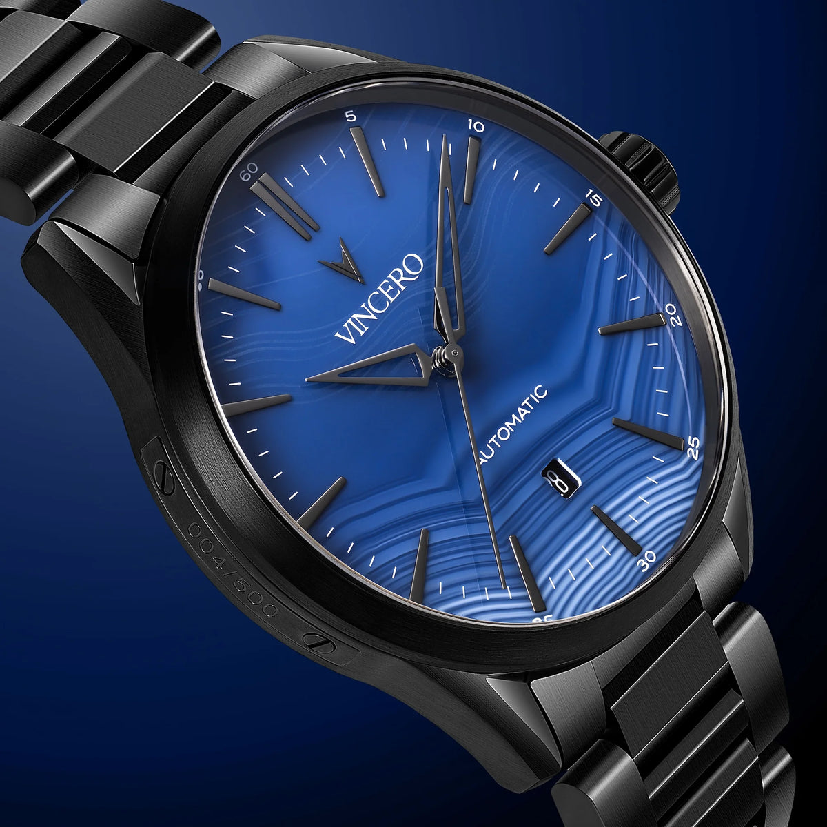 Black wristwatch with blue dial on a dark blue background