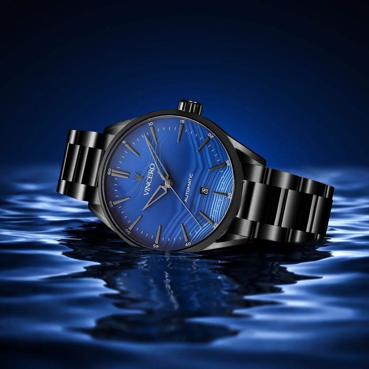Black wristwatch with blue face on water
