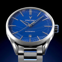 Silver watch with blue dial on a dark background