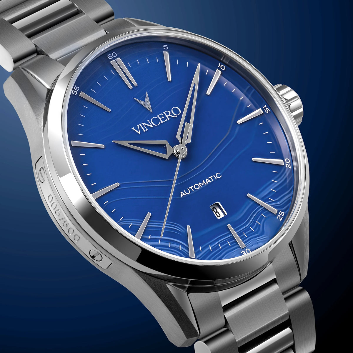 Silver wristwatch with a blue dial on a dark blue background