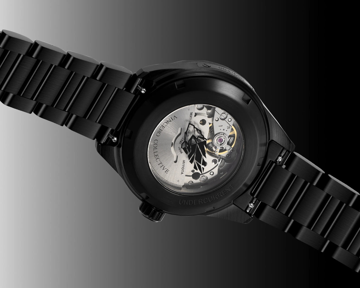 Black watch with visible mechanical components on a dark background