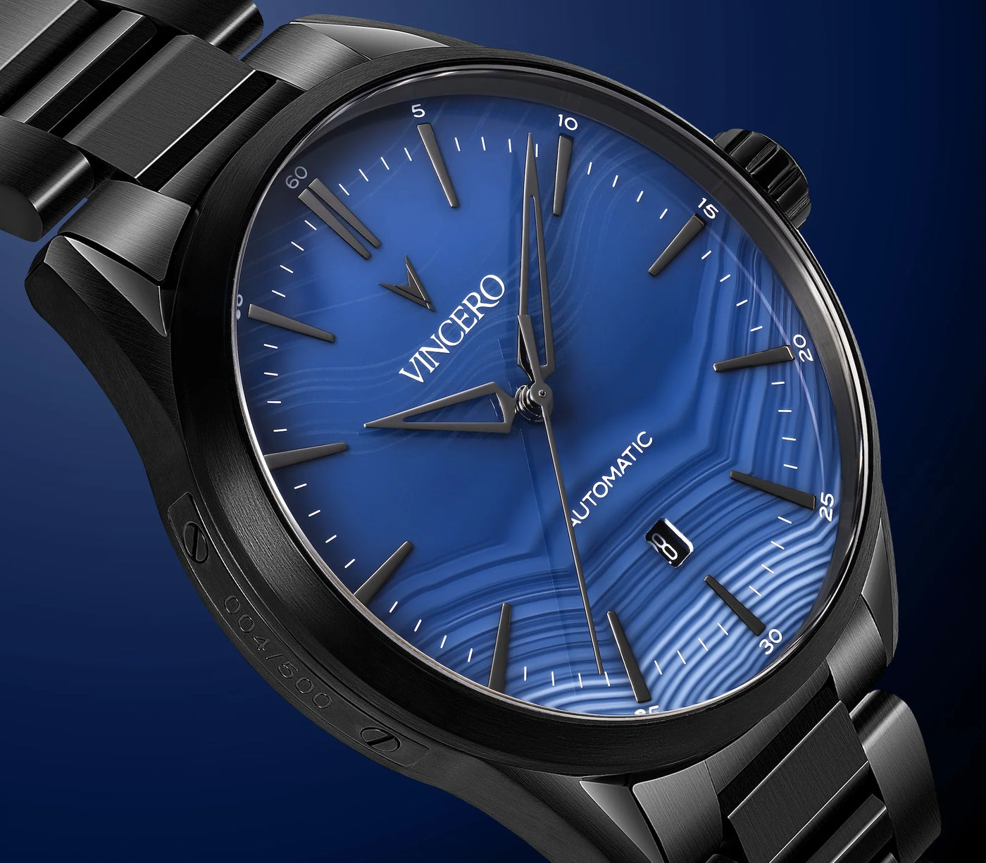 Black wristwatch with blue dial featuring the brand 'Vincero' on a dark blue background