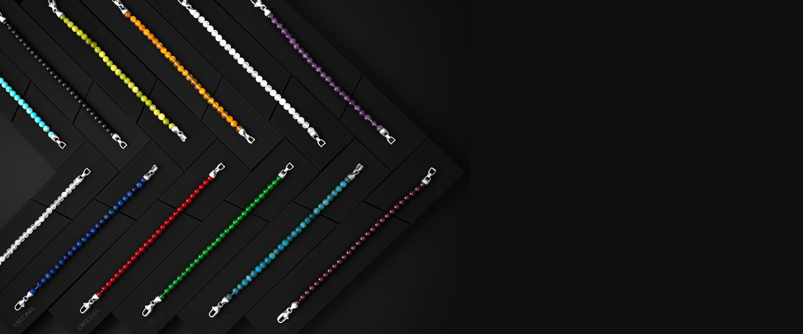 Colorful beaded bracelets on a dark surface