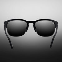 Black sunglasses with a gradient gray background