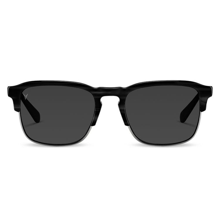 A pair of black sunglasses with a smoky gray lens, featuring premium acetate frames with marble accents and stainless steel hardware.