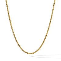 Gold chain necklace on a white background