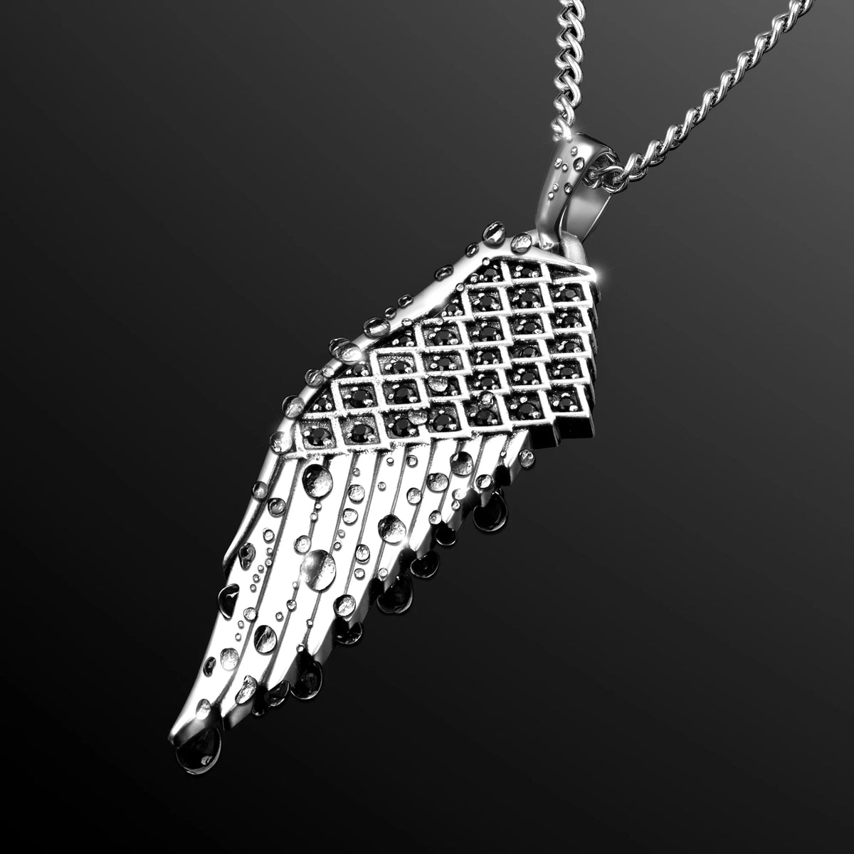 Silver wing-shaped pendant on a chain against a black background