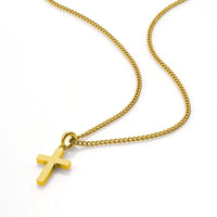 Gold necklace with a cross pendant on a white background