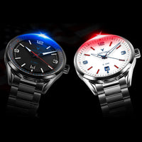 Two Vencchia stainless steel wristwatches with metal link bands, shown side by side on a black background. The watch on the left has a black dial with a blue-lit bezel and red hands.