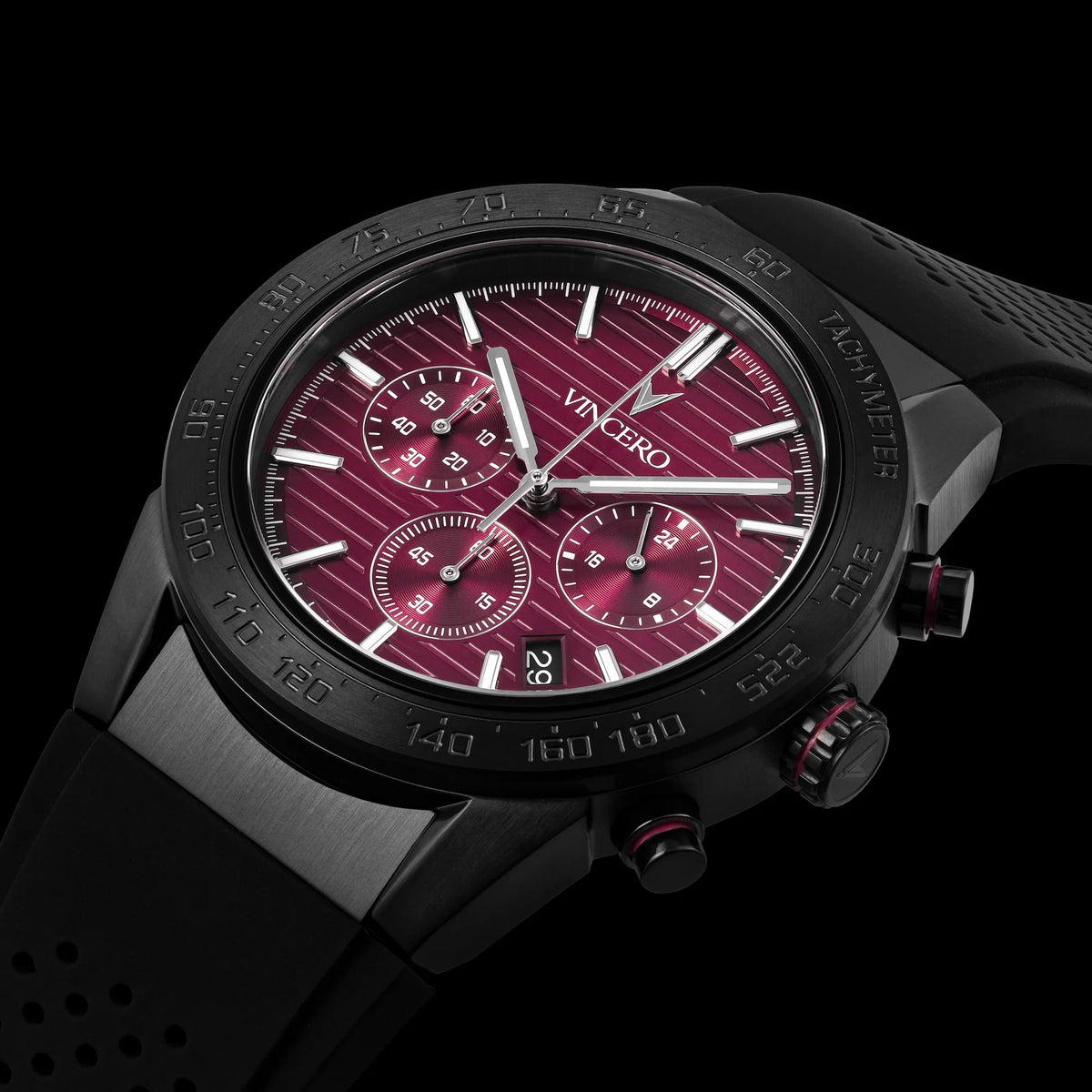 Black wristwatch with a red face on a black background