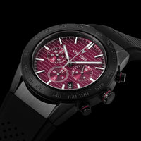 Black wristwatch with a red face on a black background